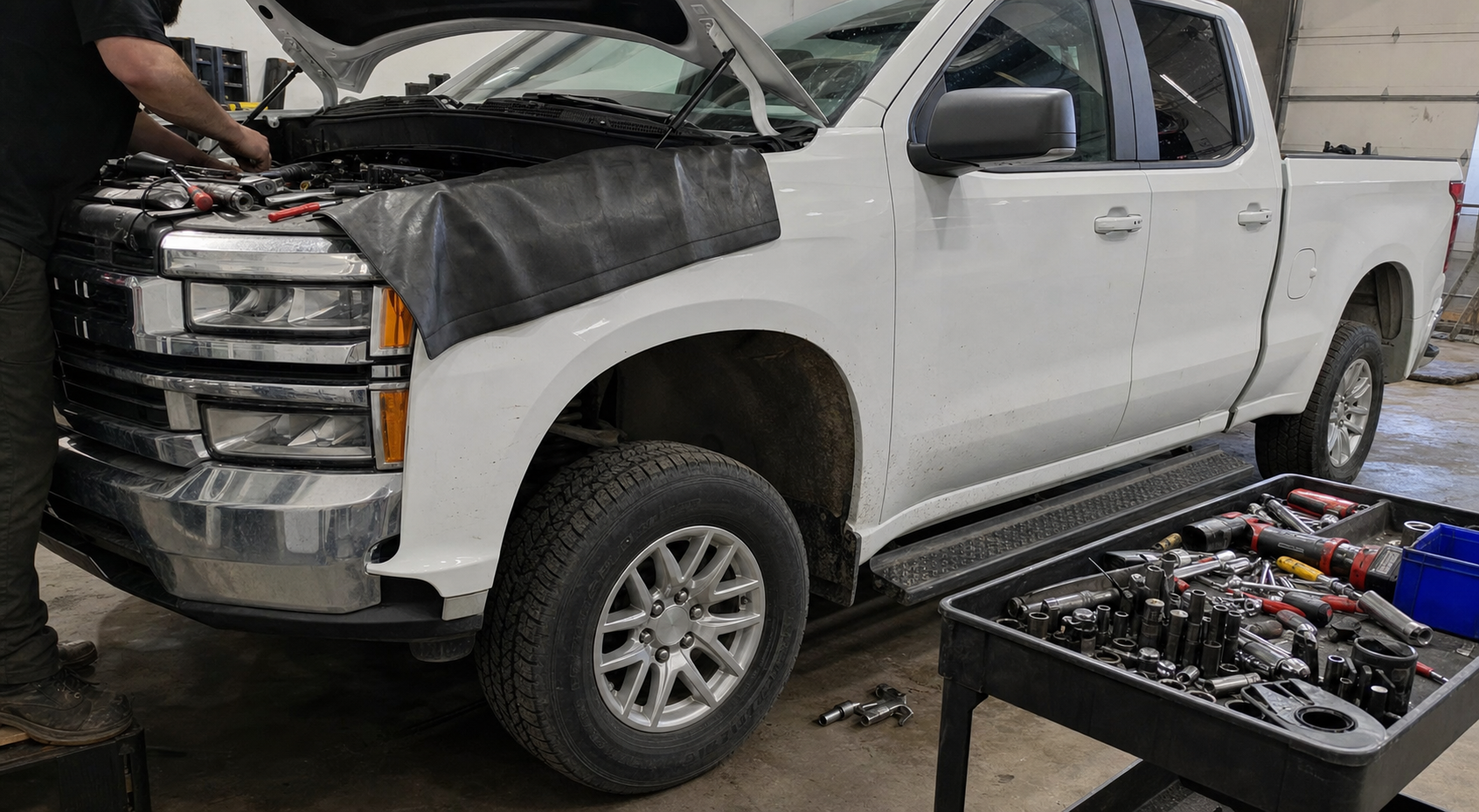 Pickup truck service in a working garage with diagnostic tools